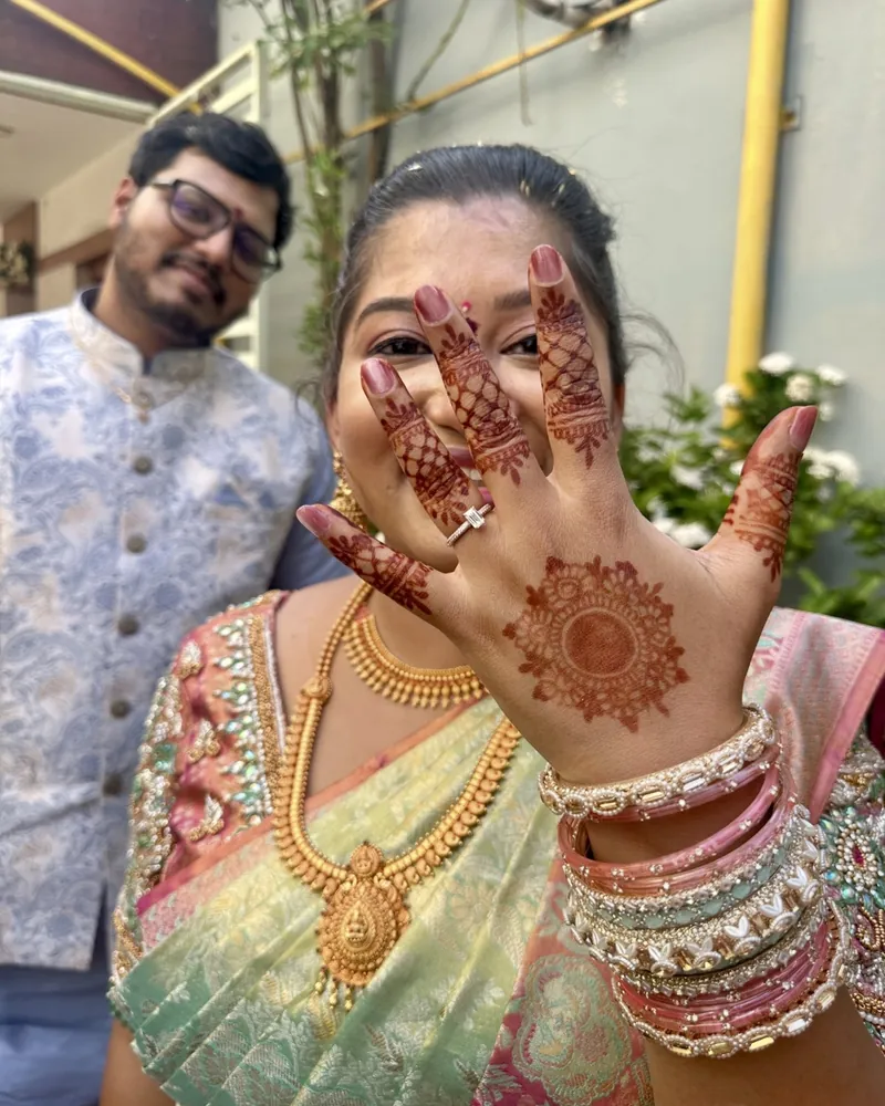 Susmita showing her ring, with Ashish behind her